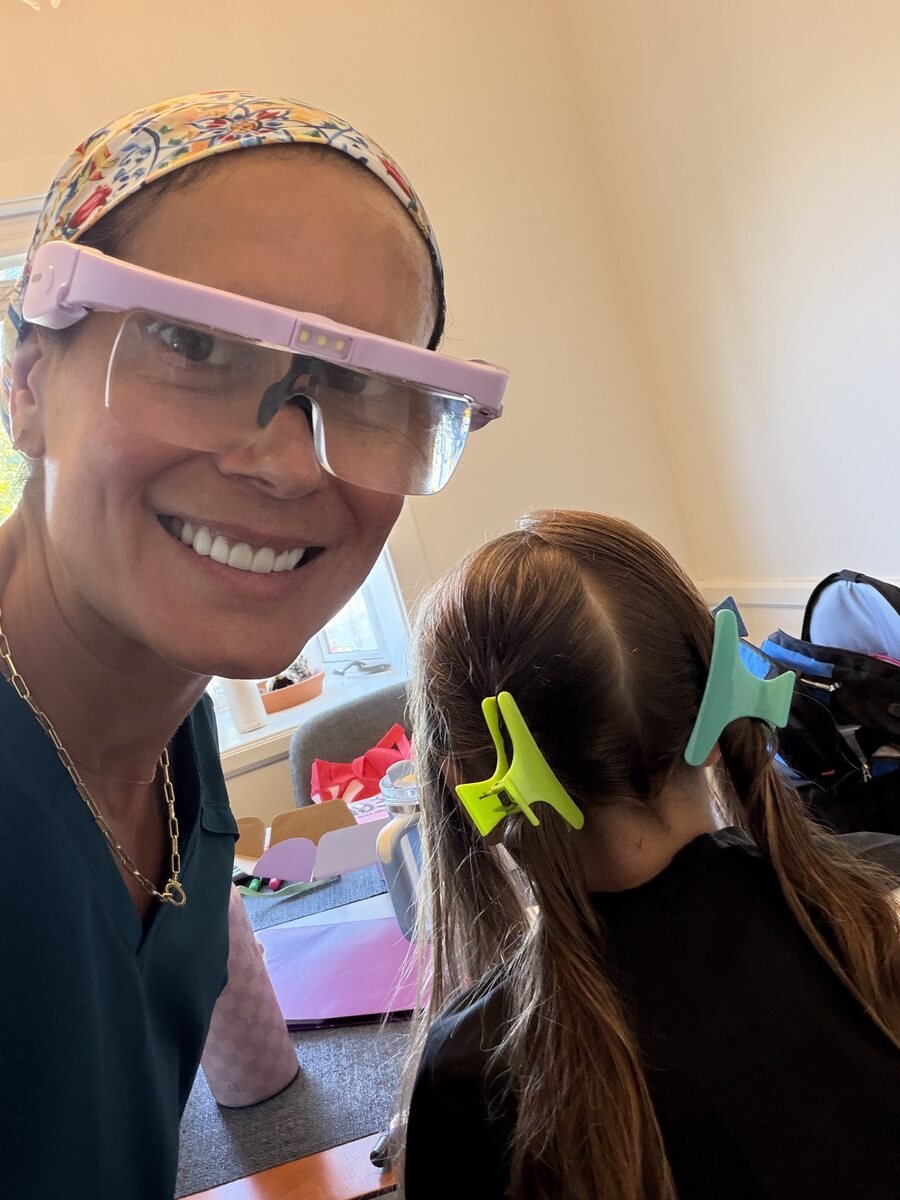 Tara performing an in-home lice check on a child in the South Bay.