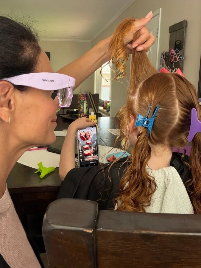 Tara performing an in-home lice check and treatment on a child in the South Bay.