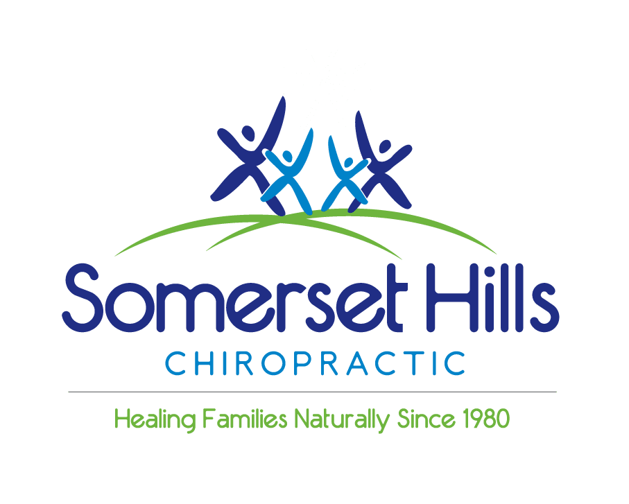 Logo for Somerset Hills Chiropractic featuring stylized figures celebrating on a grassy hill with a shining sun, tagline 'Healing Families Naturally Since 1980'.