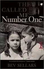 Black and white photo of two young girls, one whispering to the other, with a book titled 'They Called Me Number One' by Bev Sellars in the background.