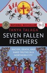The book cover of 'Seven Fallen Feathers' by Tanya Talaga. It features a red and yellow crest at the top, a black banner with the title, and an illustration of Indigenous people in traditional clothing holding objects, against a blue background.