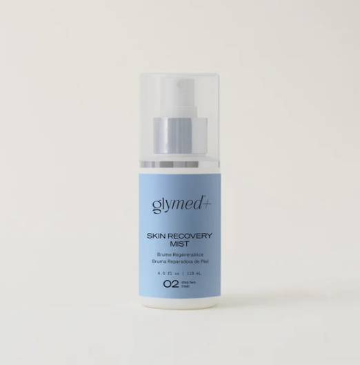 Blue and white bottle of Glymed Skin Recovery Mist with spray nozzle