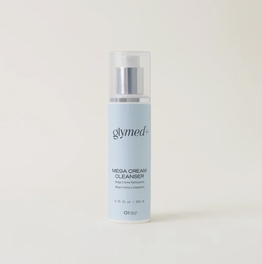 A light blue bottle of Glymed MEGA Cream Cleaner with a clear pump dispenser and a white cap, standing against a plain, off-white background.