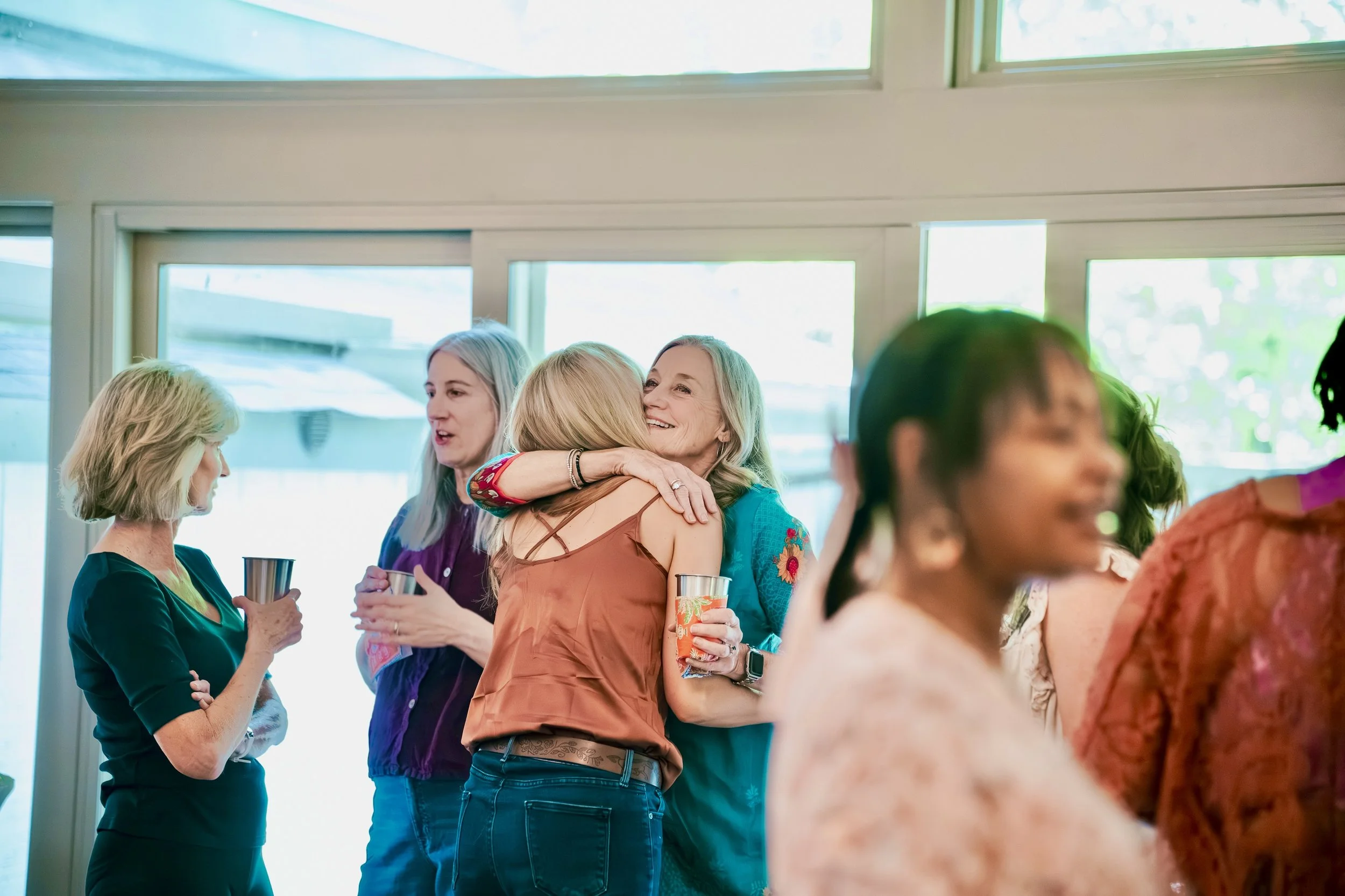 Sakhi Yoga students gather together at a community gathering welcoming teachers and practitioners.