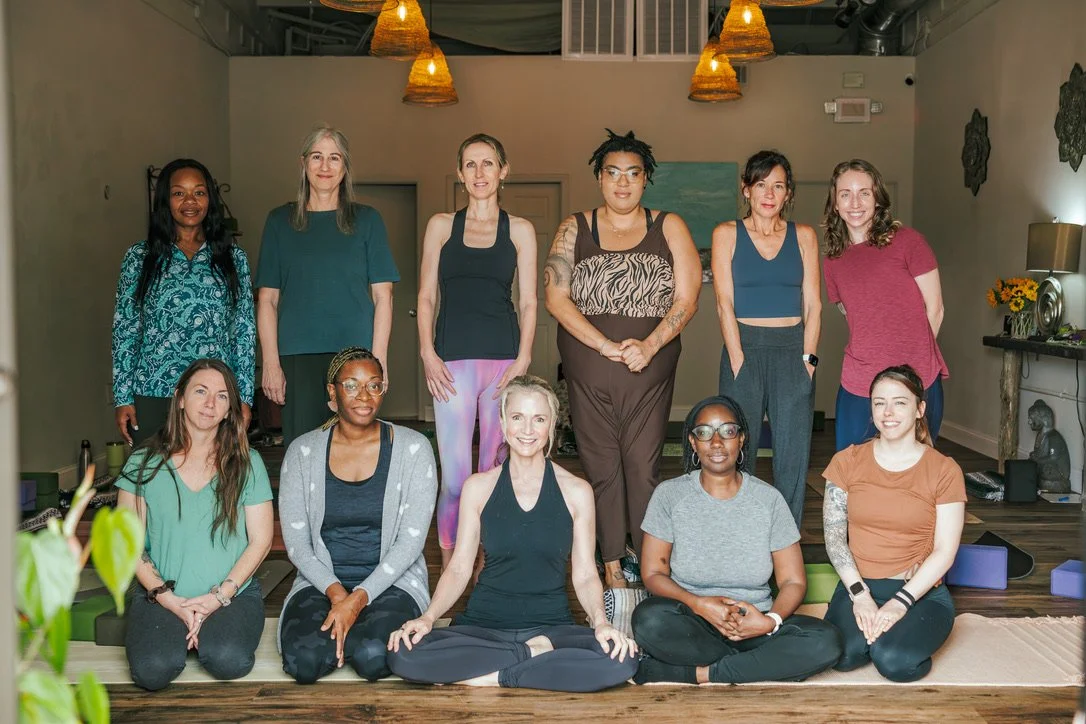 Graduates of the Sakhi Yoga School gather for a group photo.