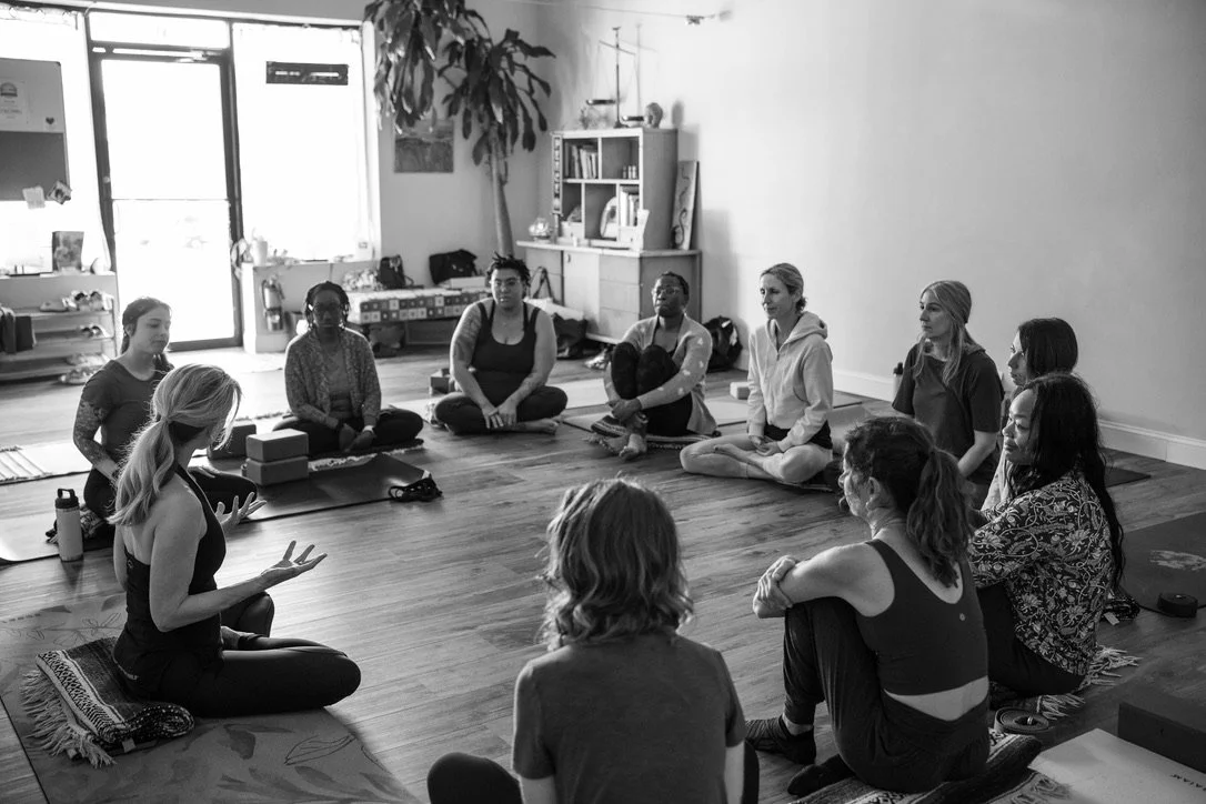Pamela Meriwether in a teacher training with students seated in a circle.