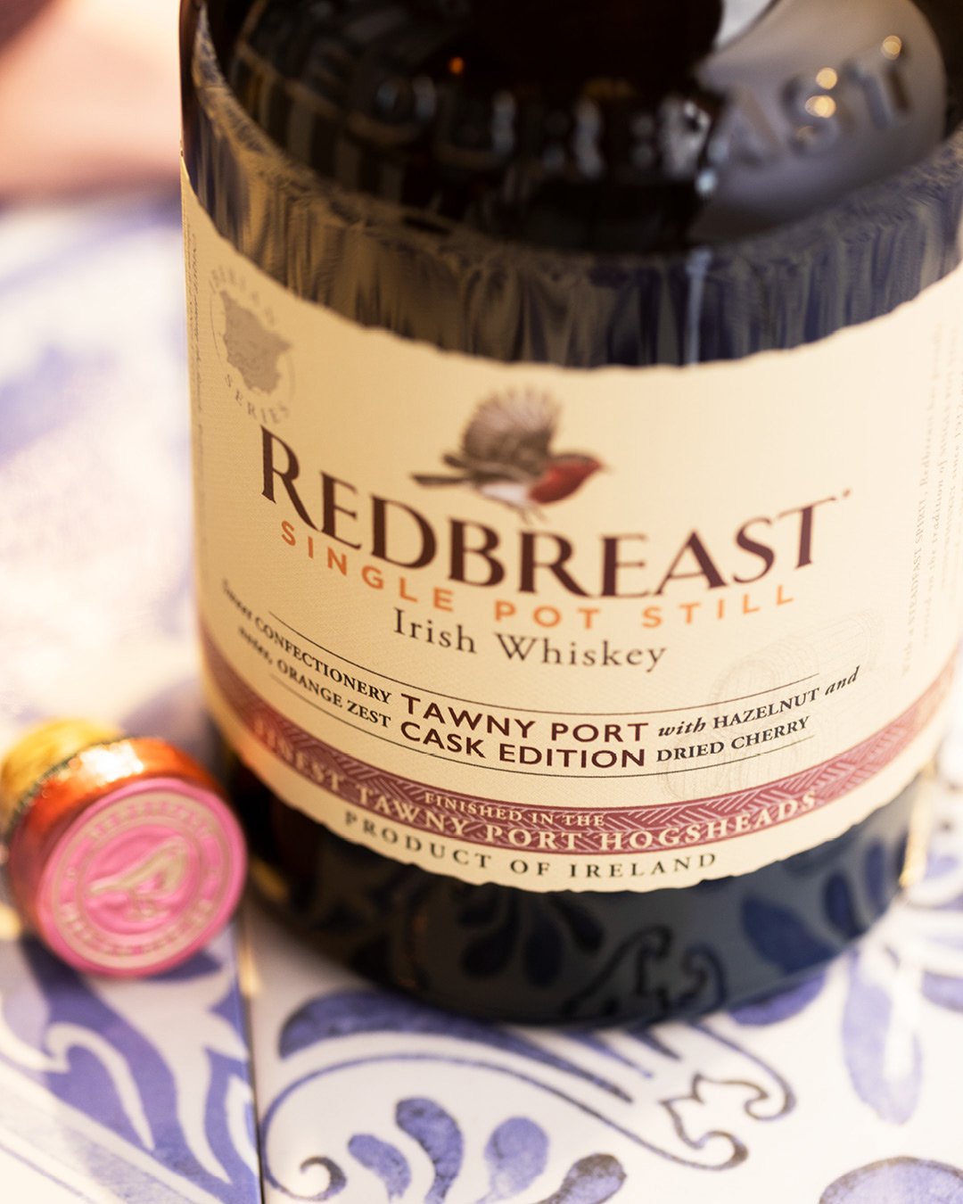 Redbreast Tawny Port Irish whiskey and cocktail lifestyle photography with warm lighting in summer setting.