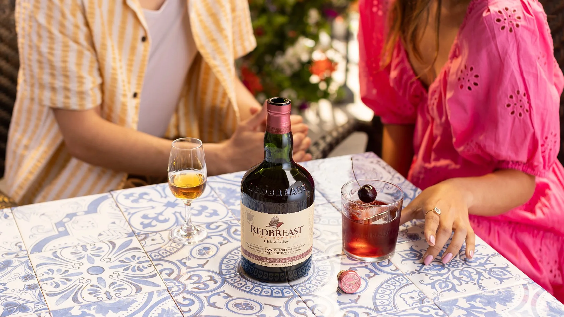 Redbreast Tawny Port Irish whiskey and cocktail lifestyle photography with warm lighting in summer setting.