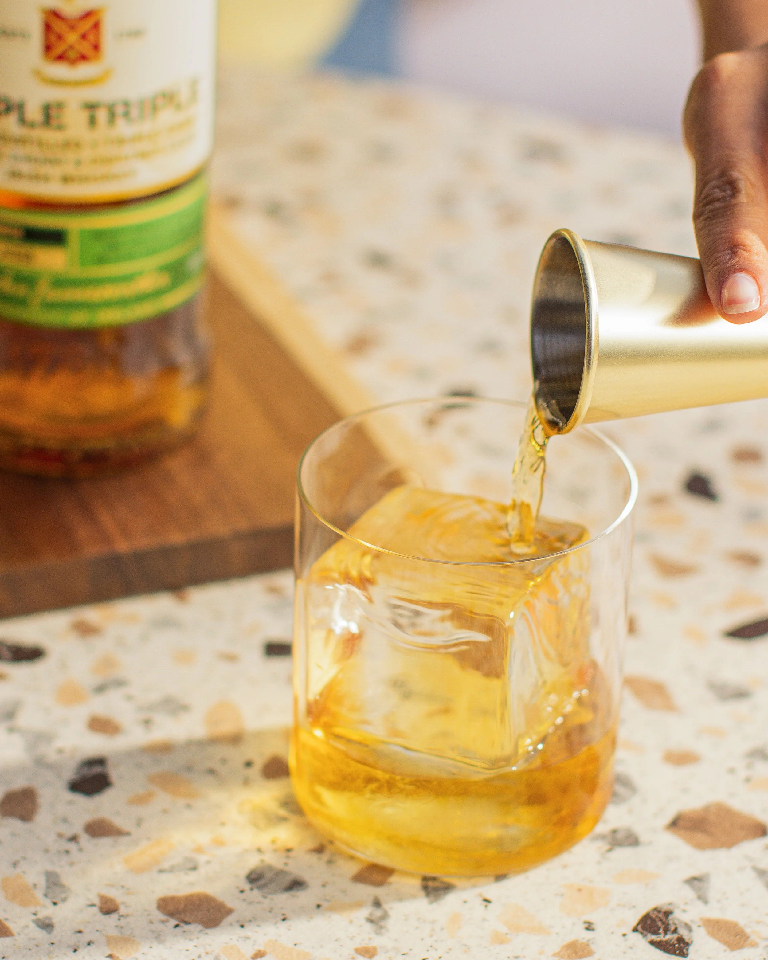 Jameson Irish Whiskey, Triple Triple, lifestyle photography by Sadhbh Kenny. Pour from Jigger into glass with golden light.