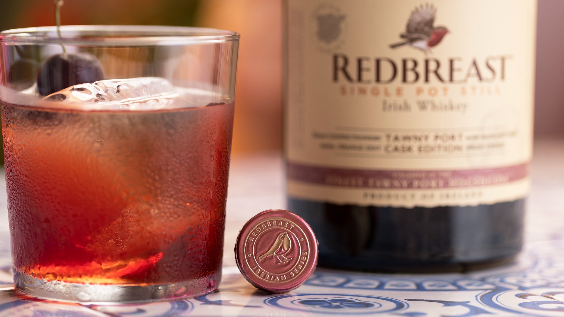 Redbreast Tawny Port Irish whiskey and cocktail lifestyle photography with warm lighting in summer setting.