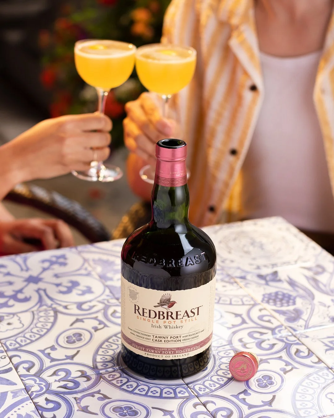 Redbreast Tawny Port Irish whiskey and cocktail lifestyle photography with warm lighting in summer setting.