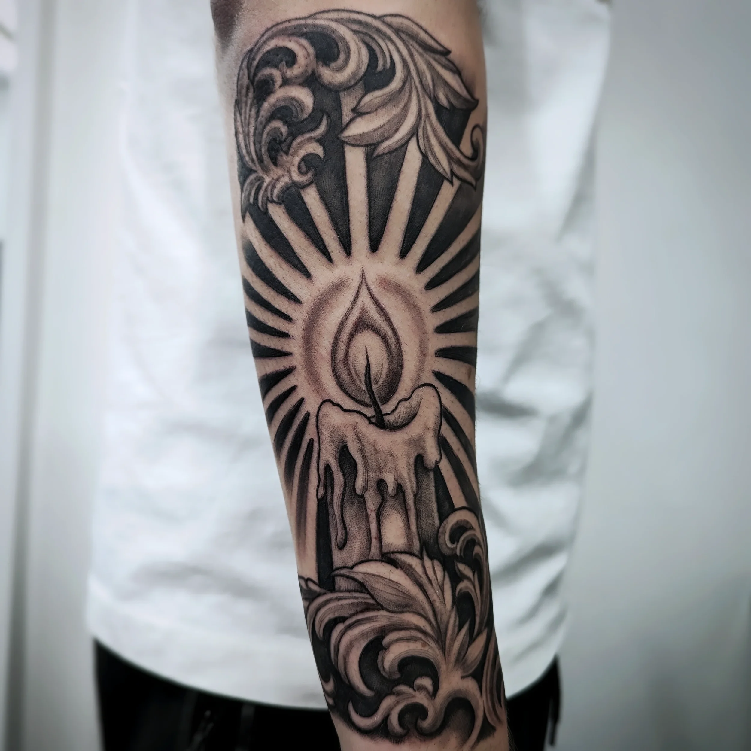 black-grey-candle-tattoo-toddington-bedfordshire.webp