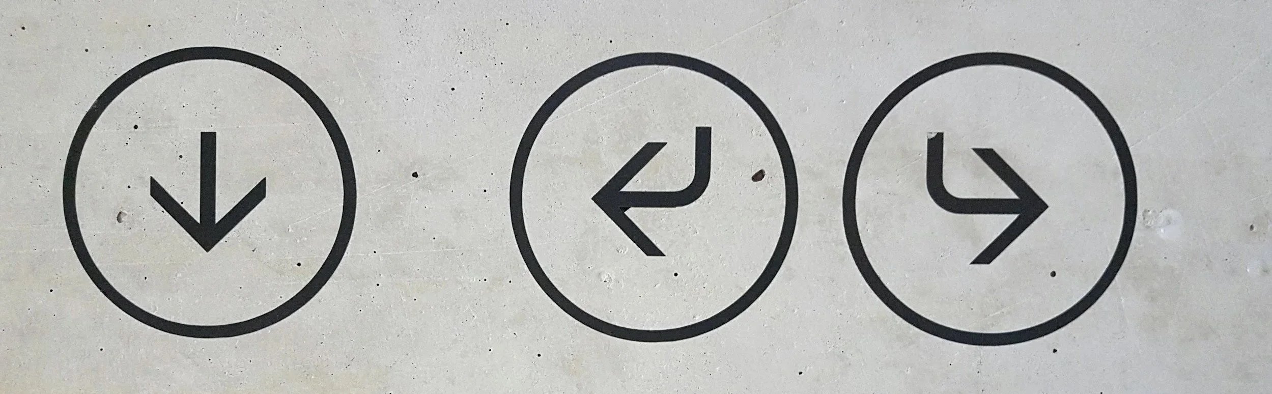 Three black circle icons on a white background with arrows indicating the direction: down, left, and right.