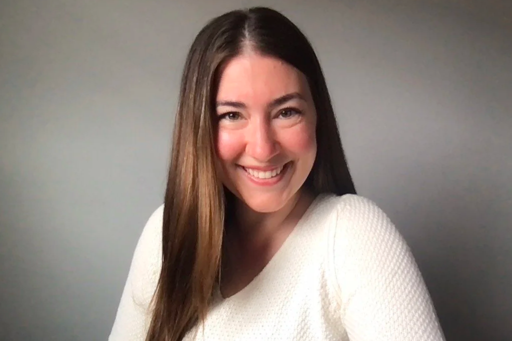 The Founder and CEO, Kristiana Haiar, smiling at the camera, wearing a white textured long-sleeve top, against a plain gray background.
