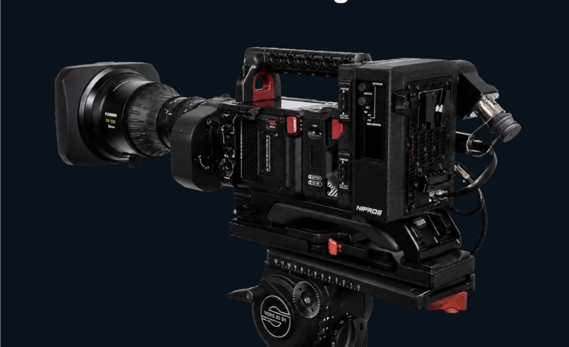 Cinema camera with a matte box, mounted on a tripod, against a dark background.