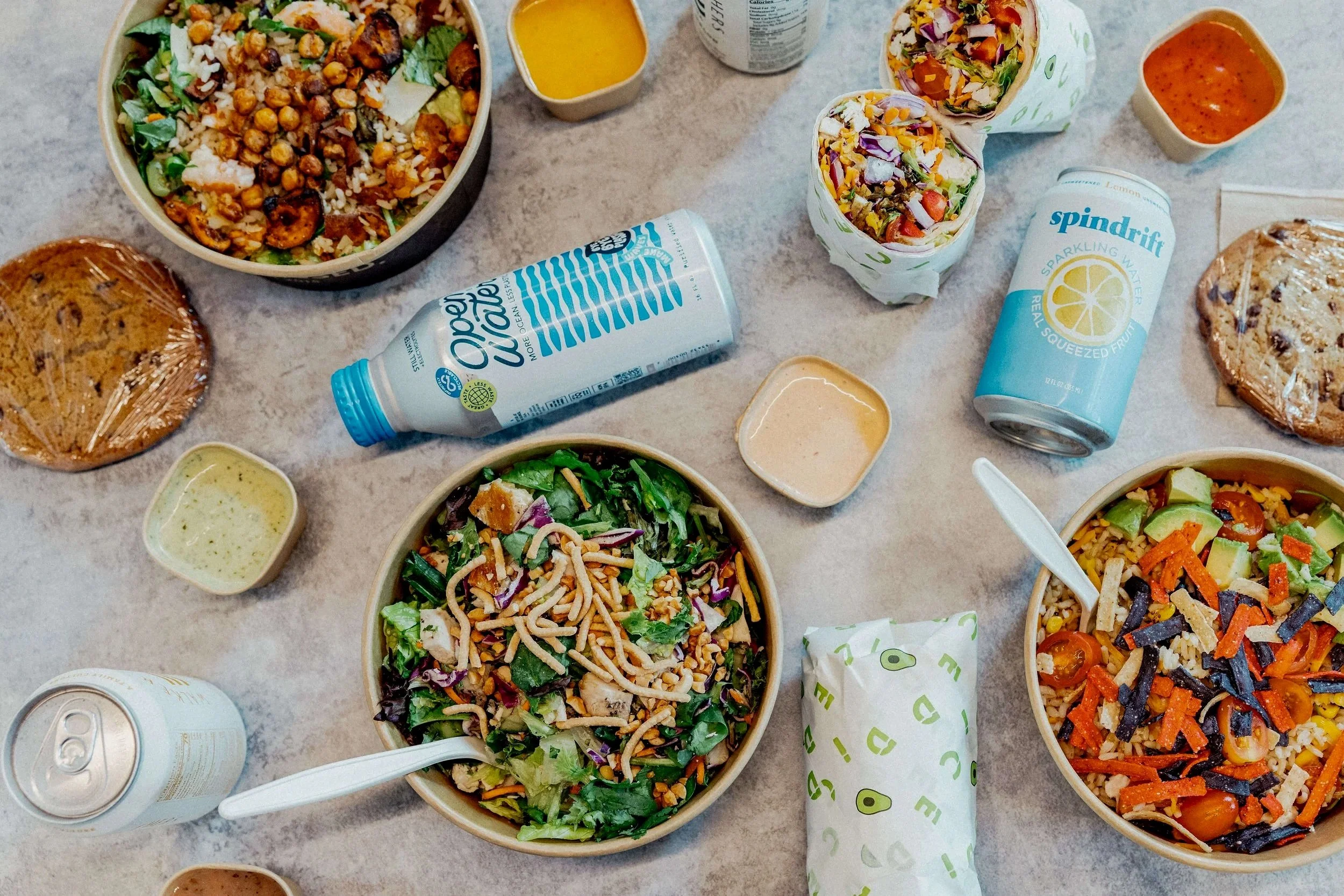Variety of salads, wraps and grain bowls with our housemade cookies