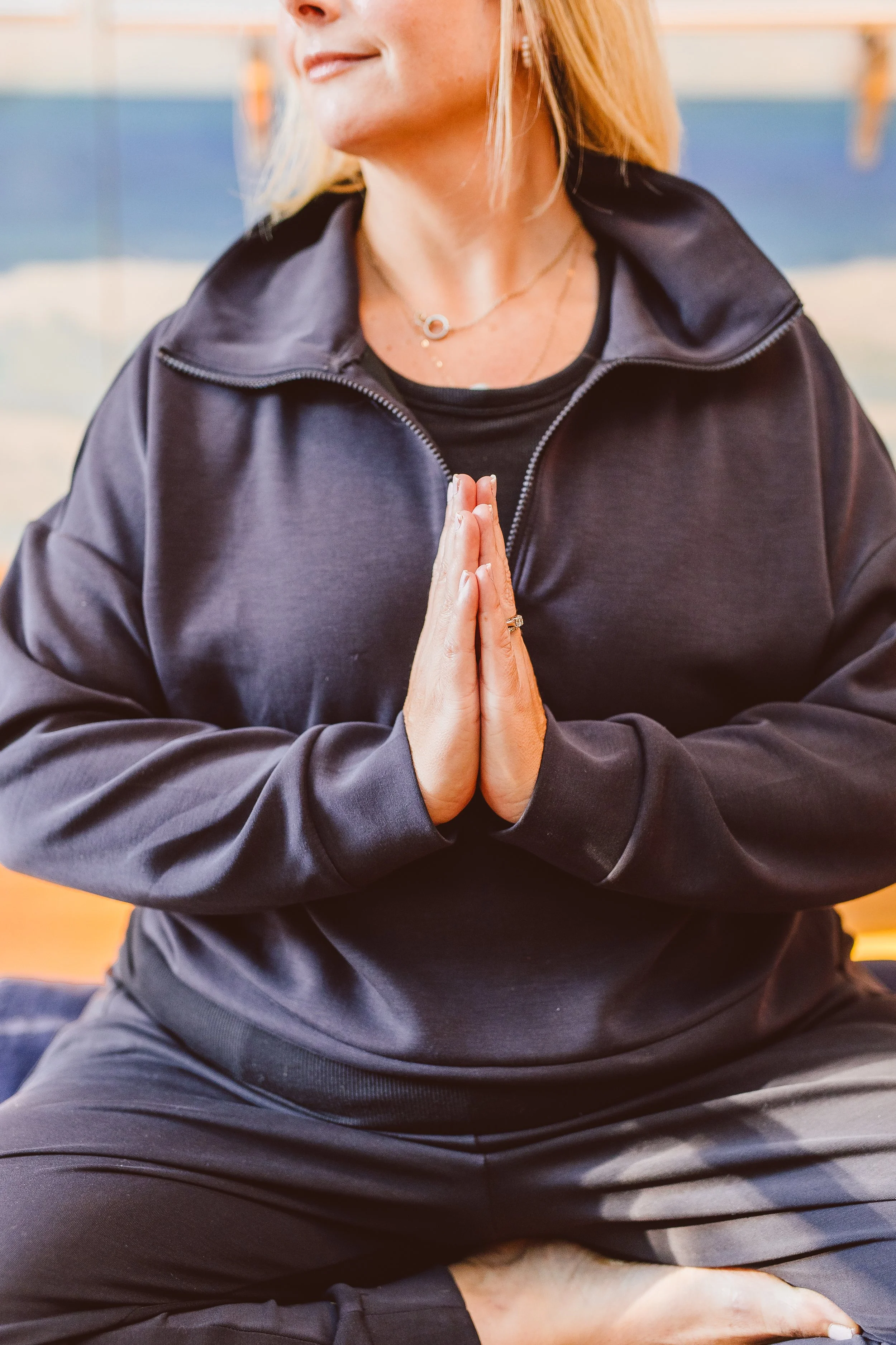 Somatic yoga meditation practice at Coastal Retreat Studios in Easton, MD — connecting mind and body through mindful movement and stillness