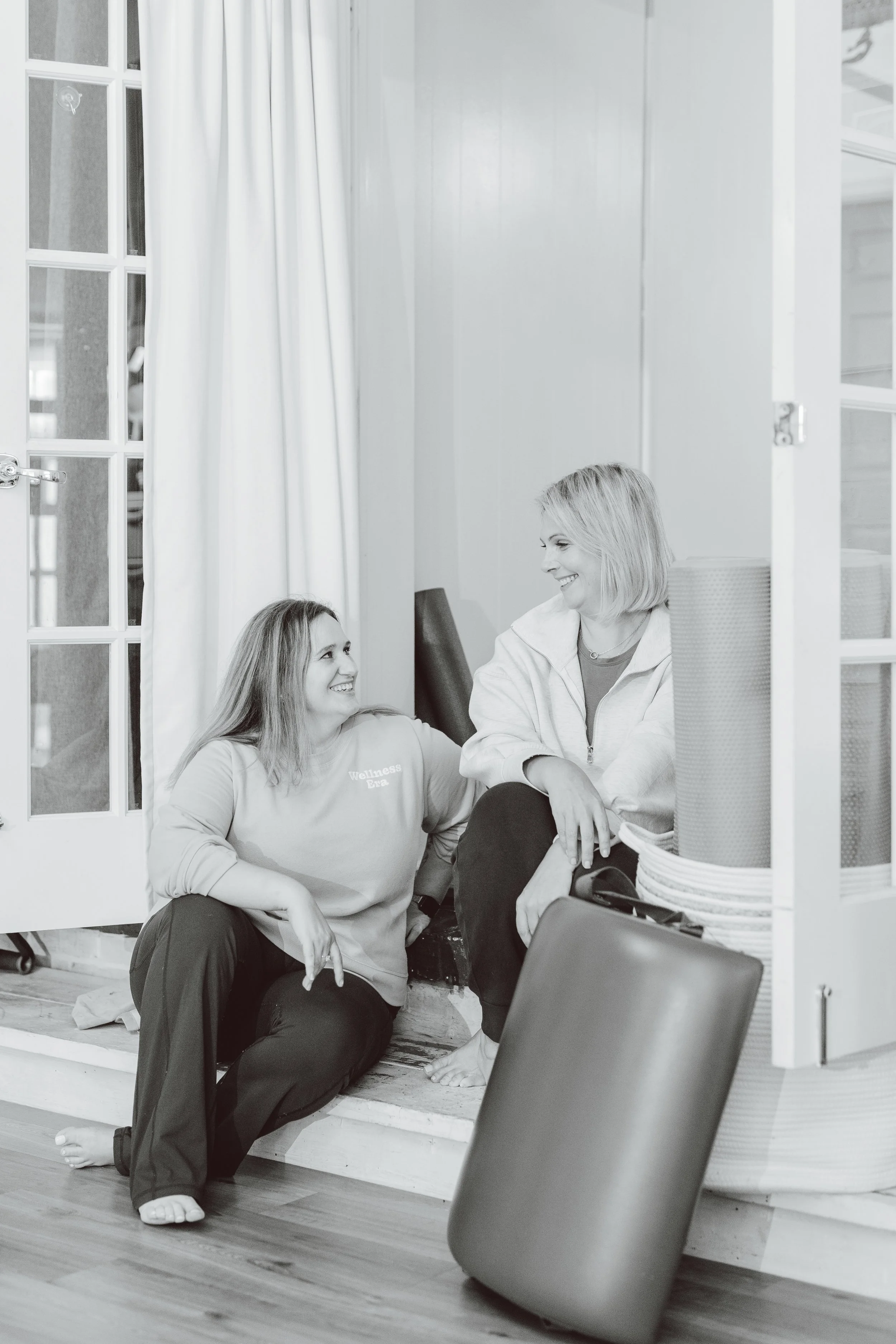 Coastal Retreat Studios client arriving for a Pilates or somatic yoga class in Easton, MD — welcoming and community-focused studio environment