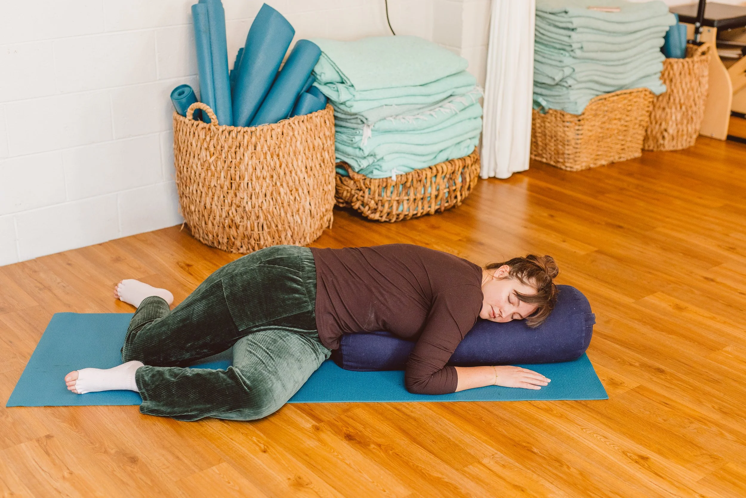 Restorative somatic yoga or Restore 30 class at Coastal Retreat Studios in Easton, MD — gentle, body-led movement for deep release and recovery