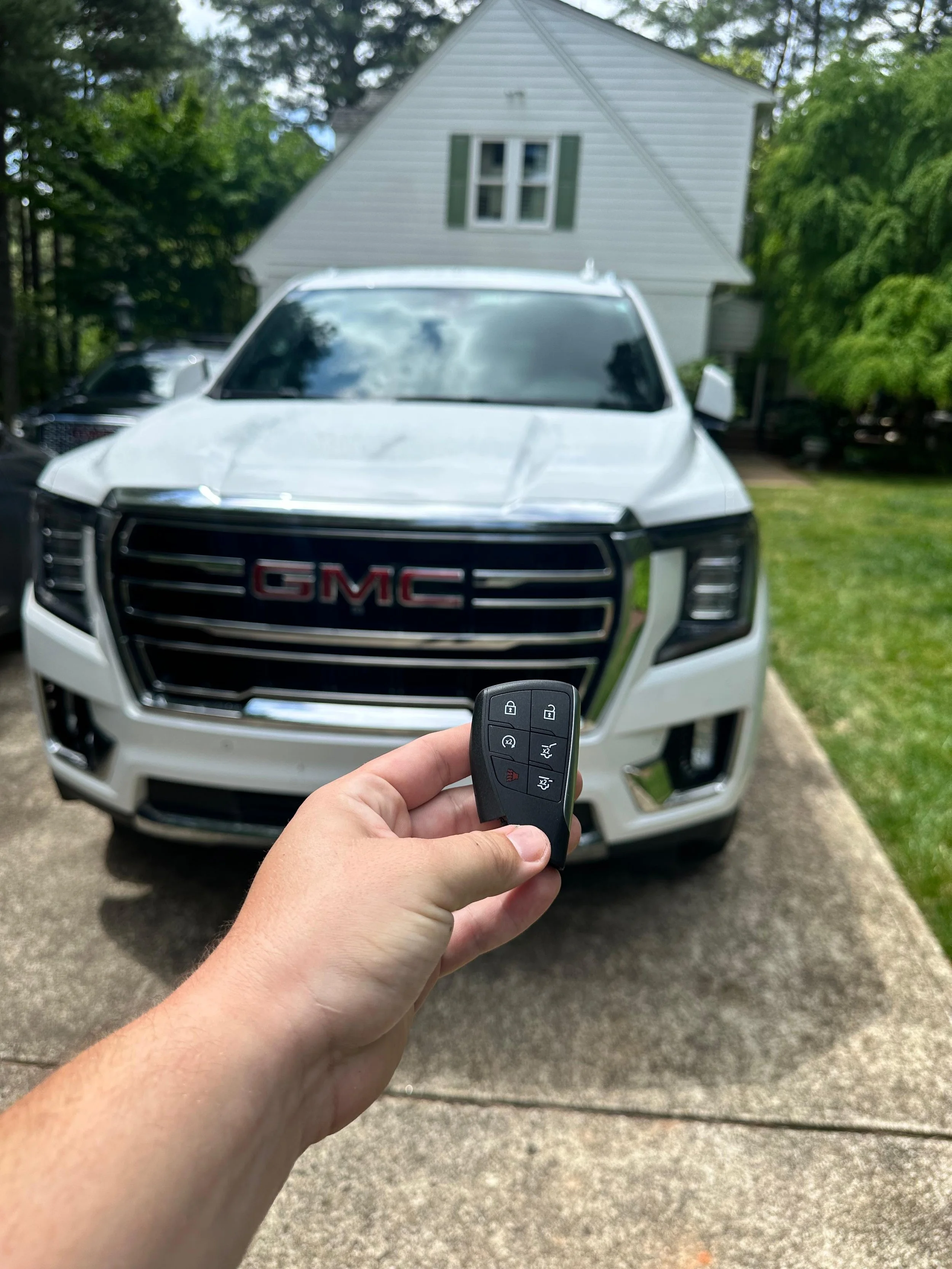 Expert Locksmith replacing a car key for a driver in Raleigh Durham NC