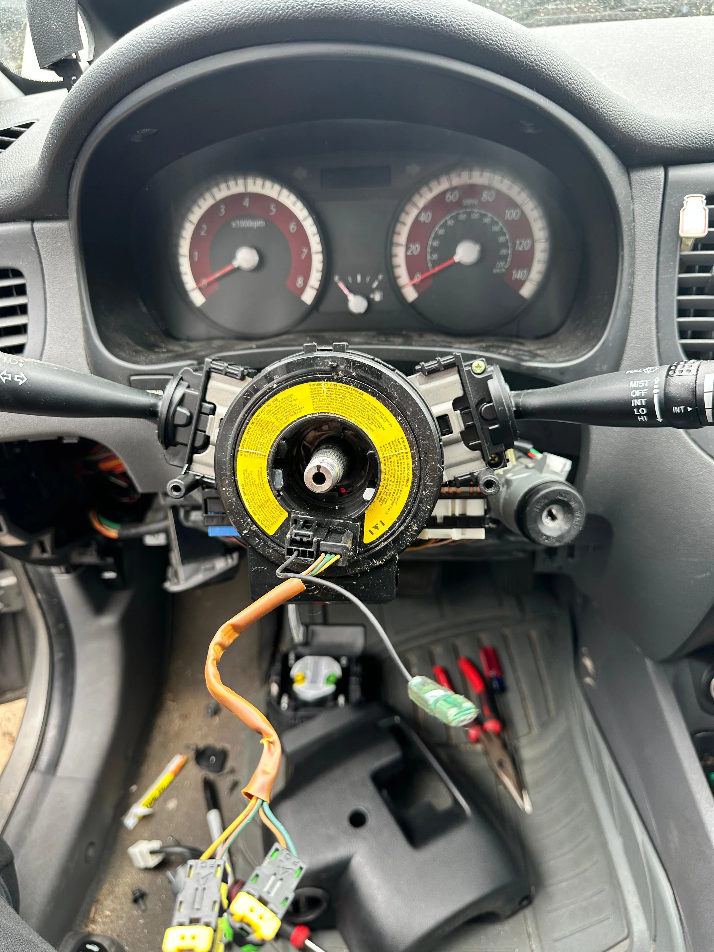 Expert Locksmith making a spare car key for a vehicle in the RDU area