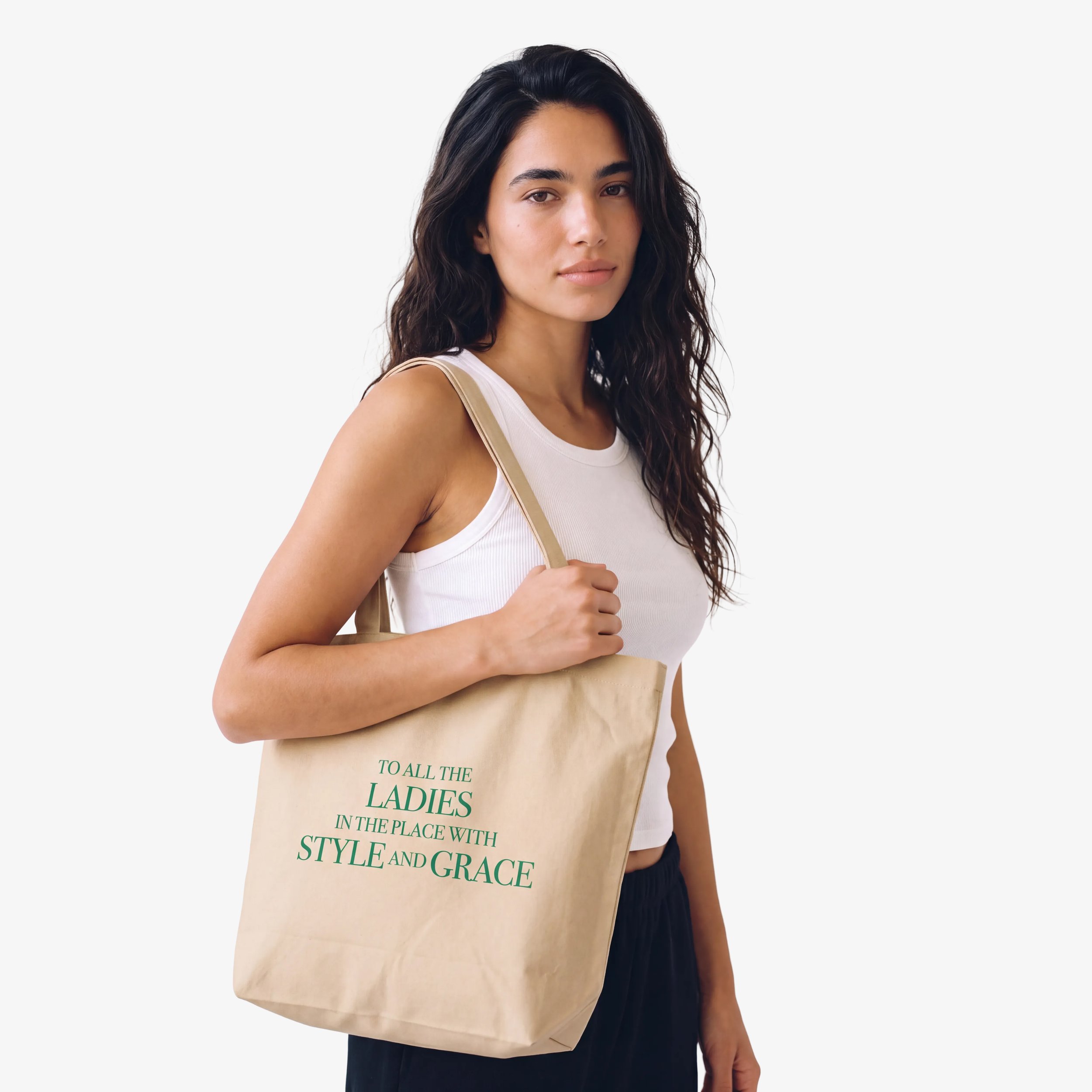 Model wearing the Fruit & Form Gentle Woman cream T-shirt with green embroidery.