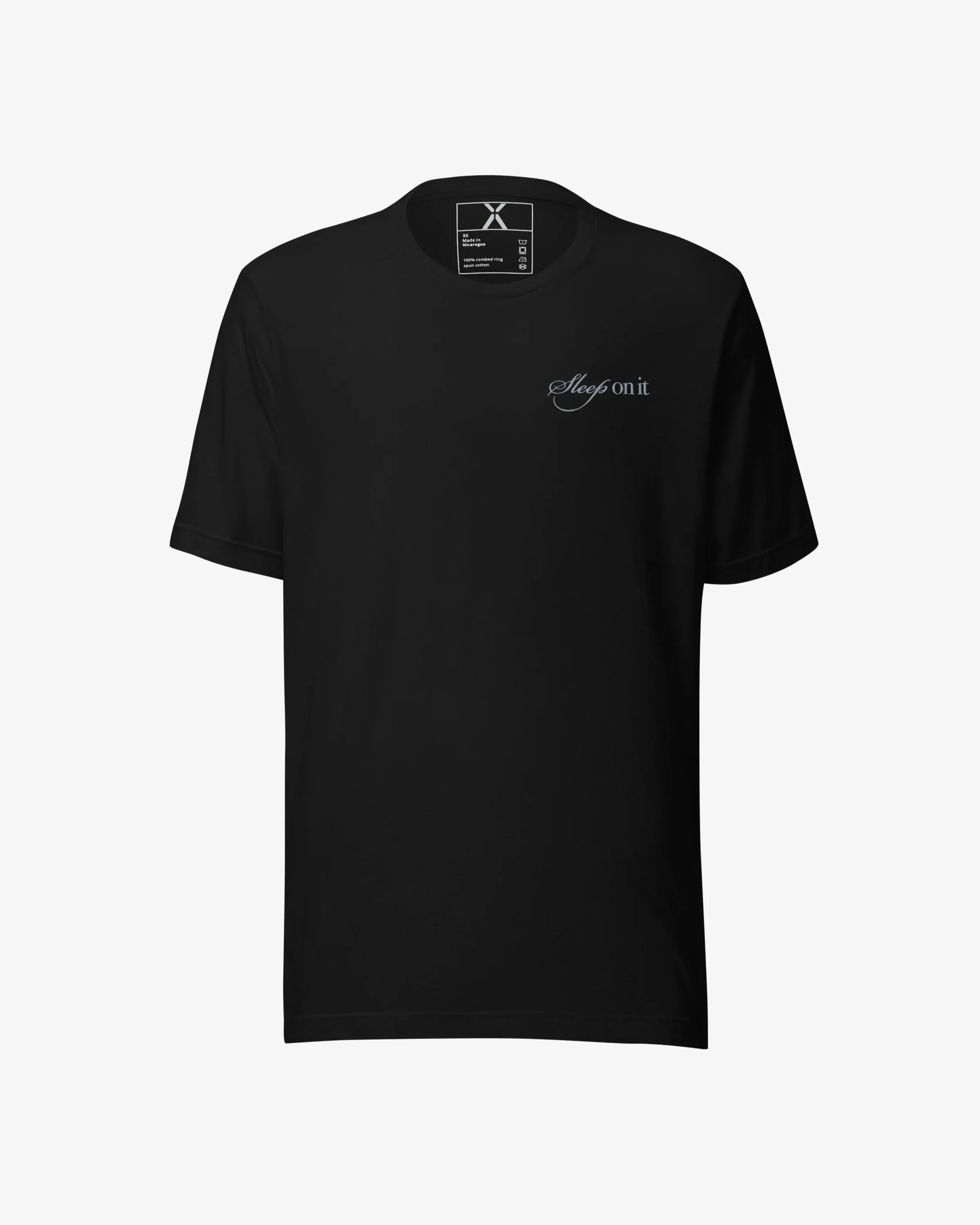 A black t-shirt with a small embroidered text saying "Sleep on it" on the upper left chest area.