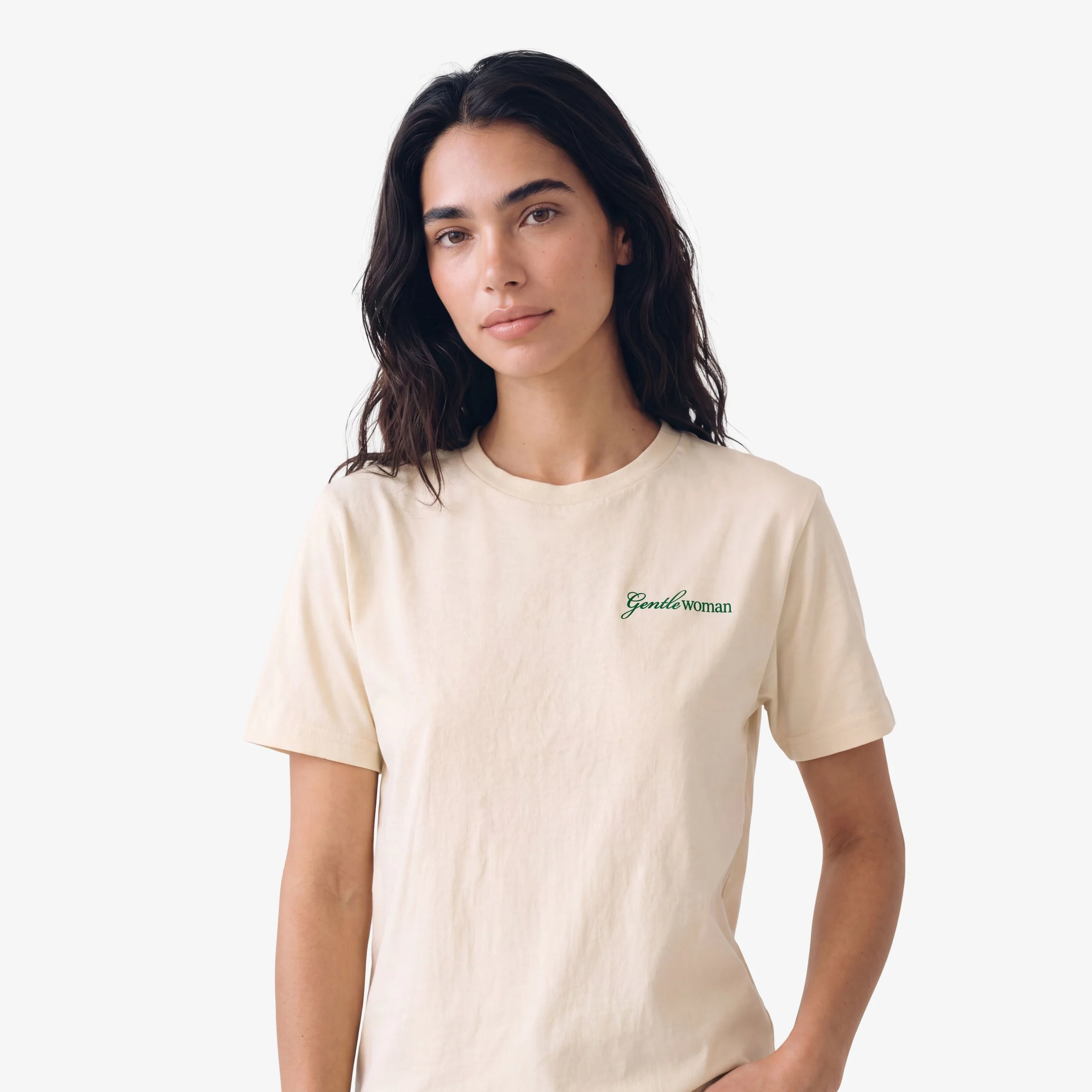 Model wearing the Fruit & Form Gentle Woman cream T-shirt with green embroidery.