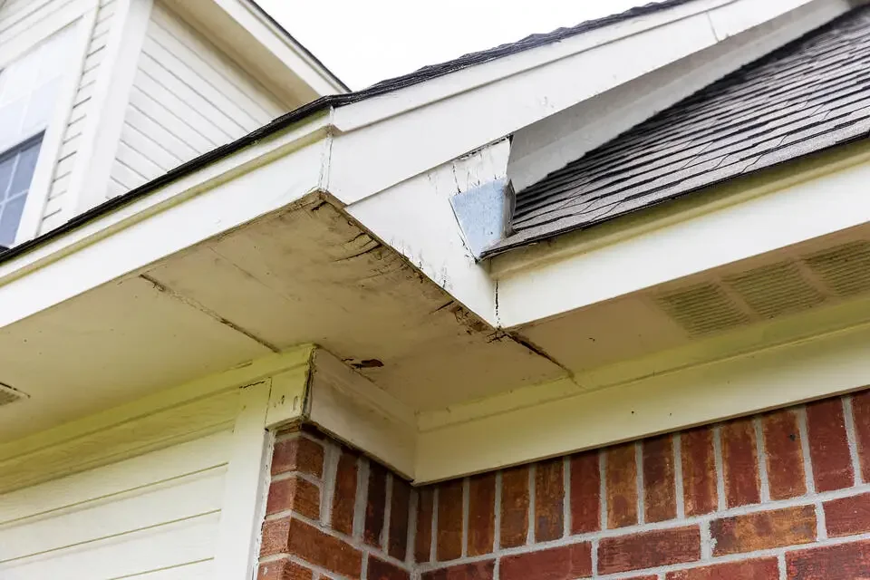 soffit-repair-old-soffits-that-need-to-be-replaced-on-a-brick-house.webp
