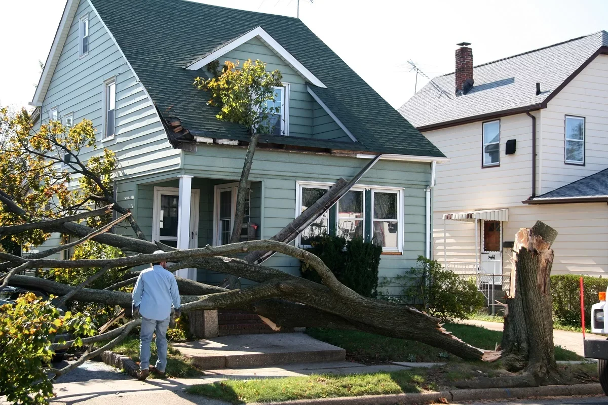 Storm-damage-to-home-exterior-siding-and-roof.webp