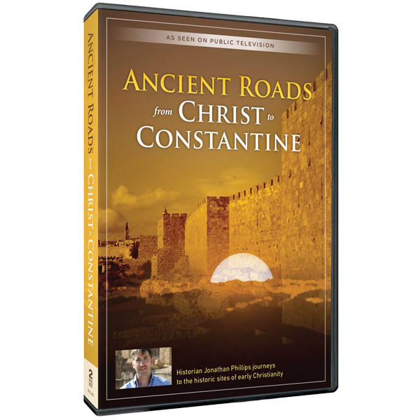 DVD case of 'Ancient Roads from Christ to Constantine' with a desert landscape and old stone wall, sunset sky, and a small photo of historian Jonathan Phillips at the bottom.