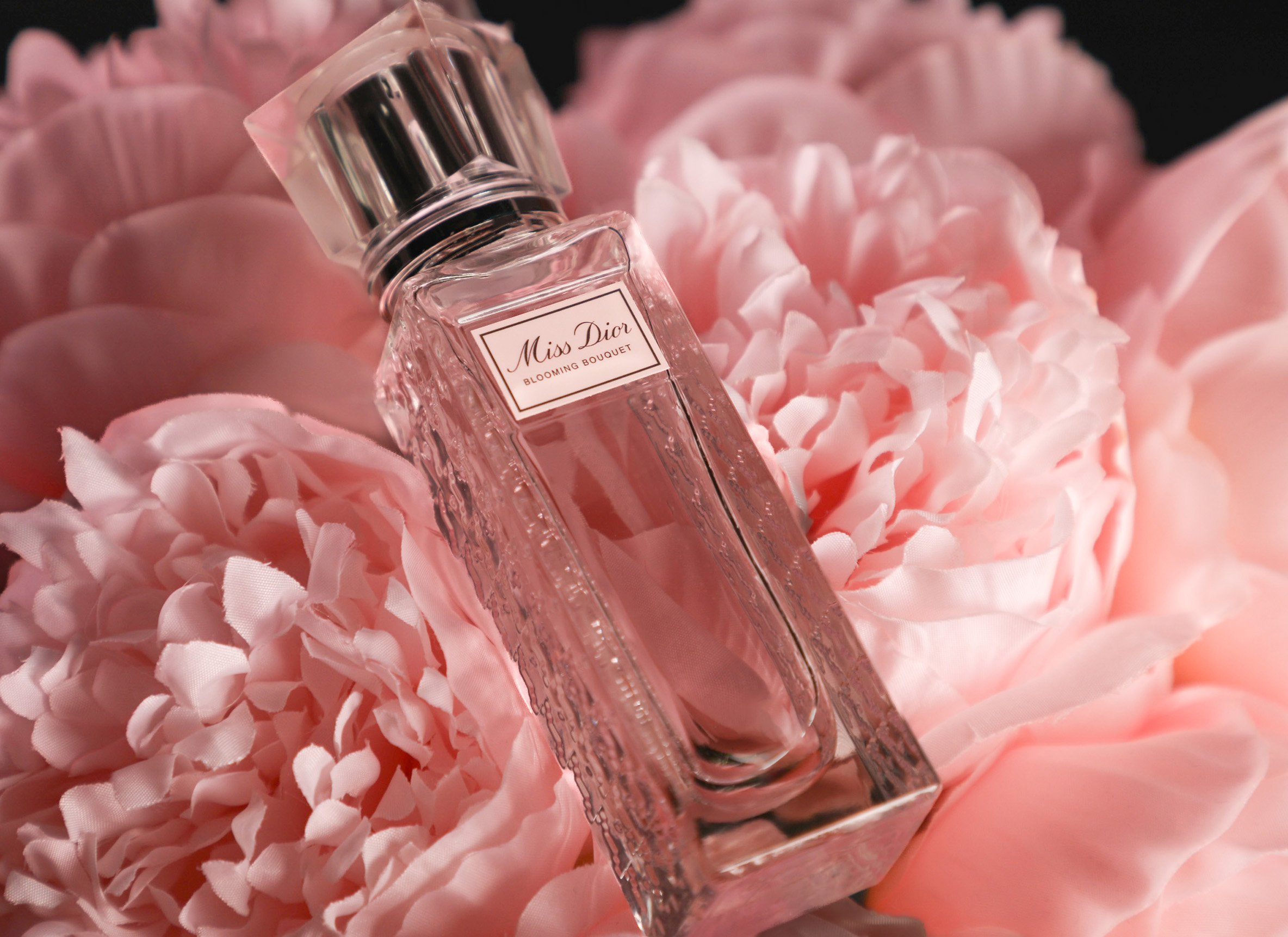 Alternative product composition exploring dynamic bottle placement and asymmetrical framing. Designed to create movement while maintaining the soft, feminine visual language of the fragrance campaign.