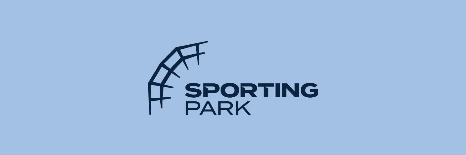 Logo for Sporting Park with a stylized curved track above the text