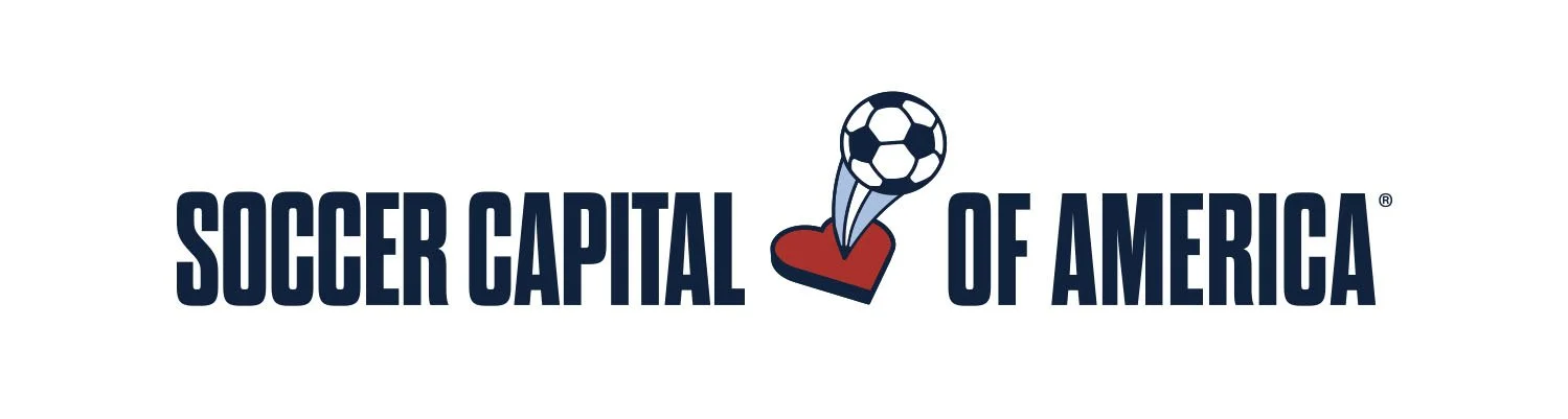 Logo of Soccer Capital of America featuring a soccer ball hitting a derby-style hat.