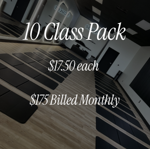 Yoga mats rolled out on the floor of a fitness studio with large windows and a black curtain. Text overlay advertising a class pack for $17.50 each, billed monthly.