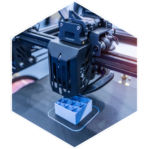A 3D printer printing a small blue object with a grid pattern on top.