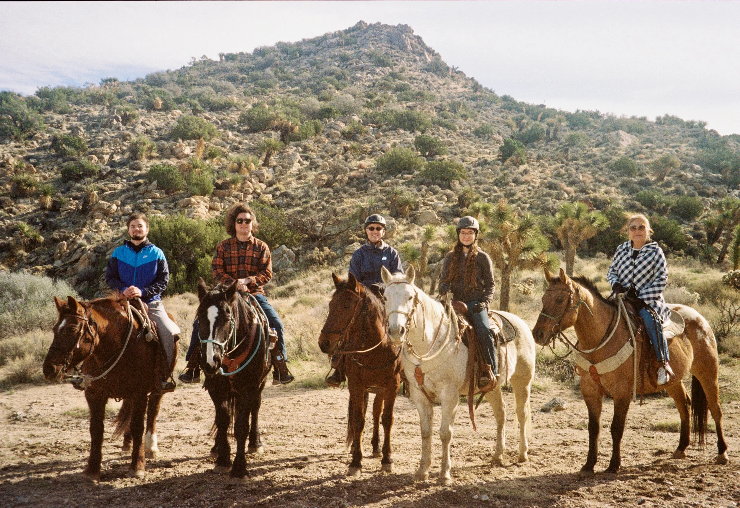 Sandy and her family riding horses.