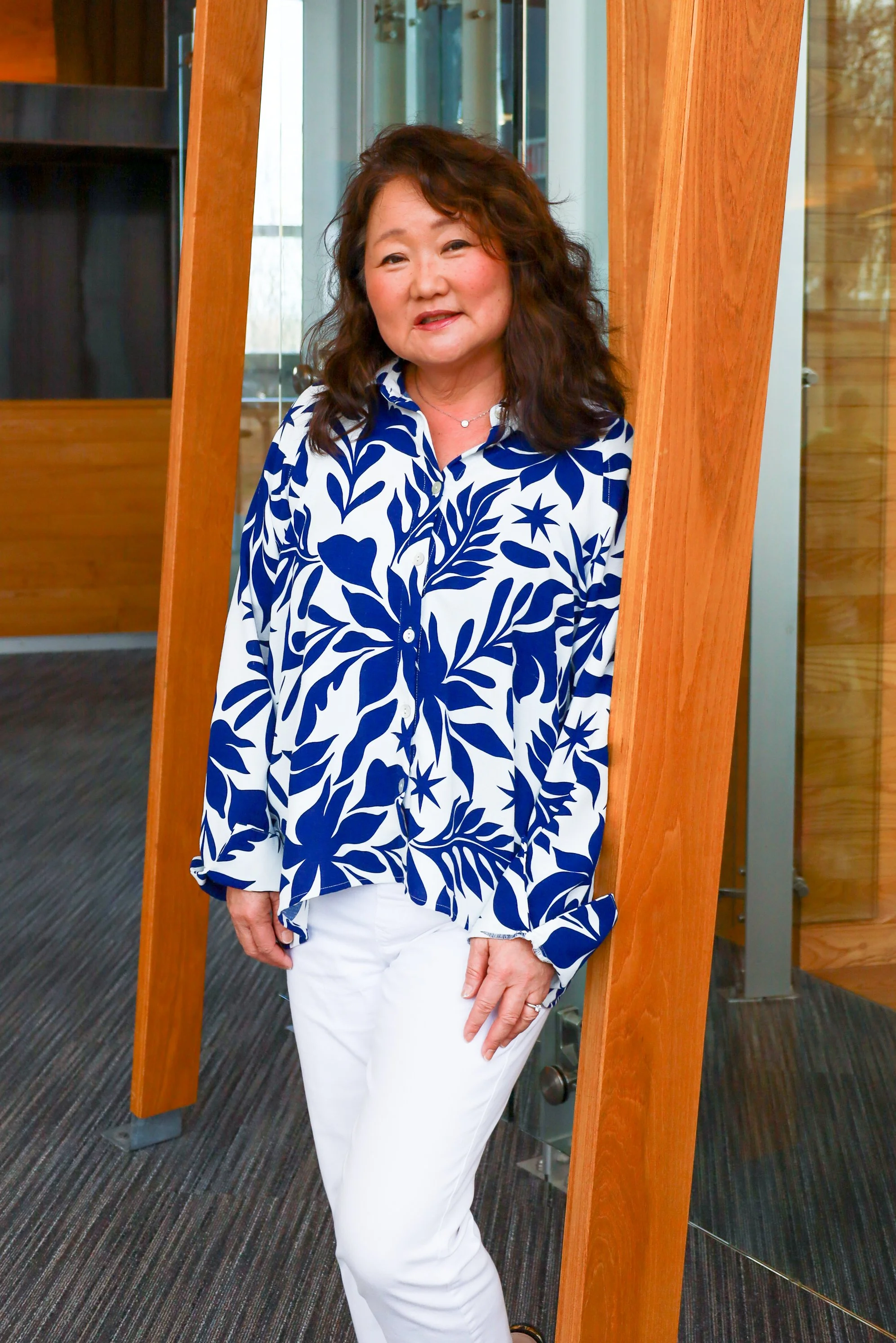 Sandy standing indoors.