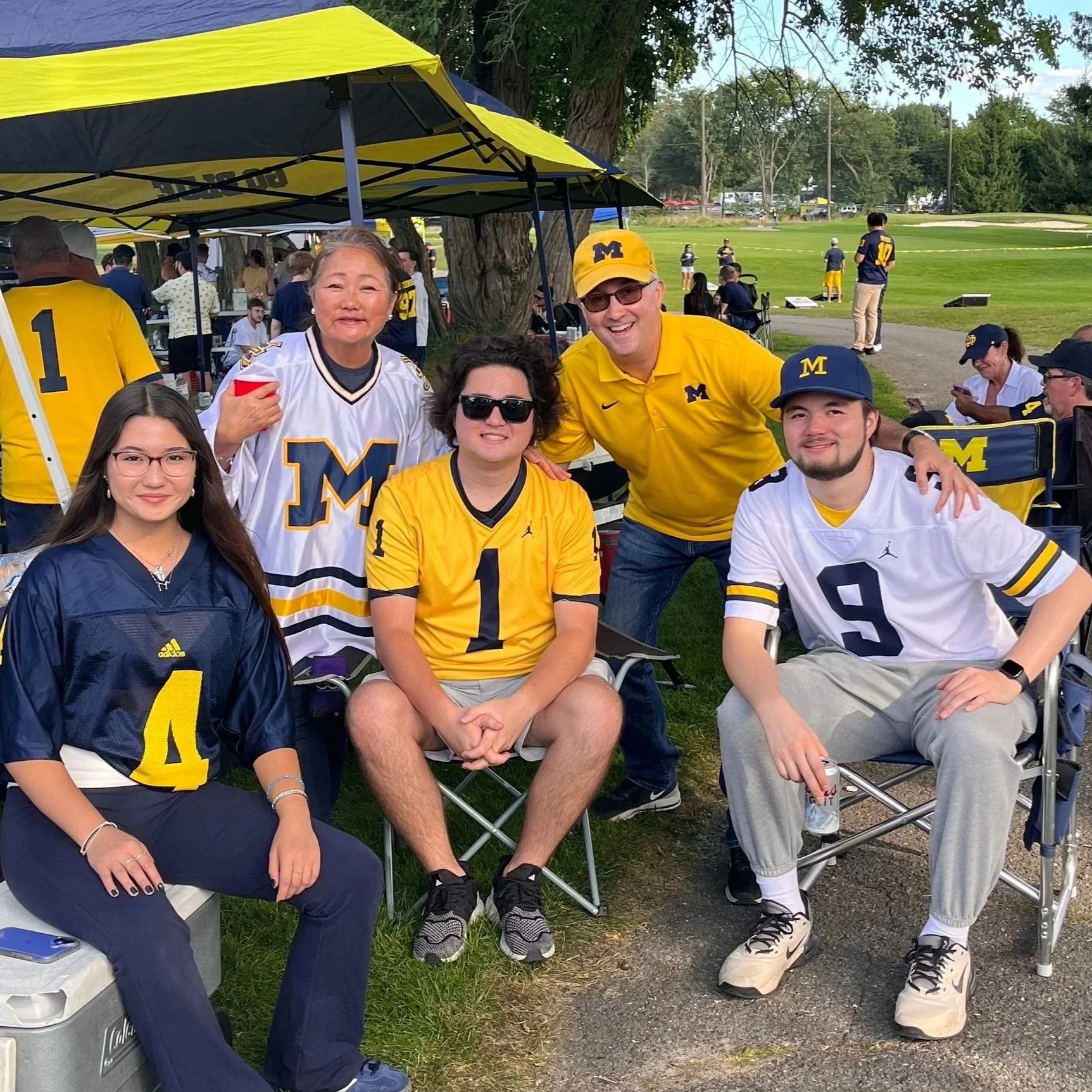 Sandy and her family tailgating before a Michigan Football game.