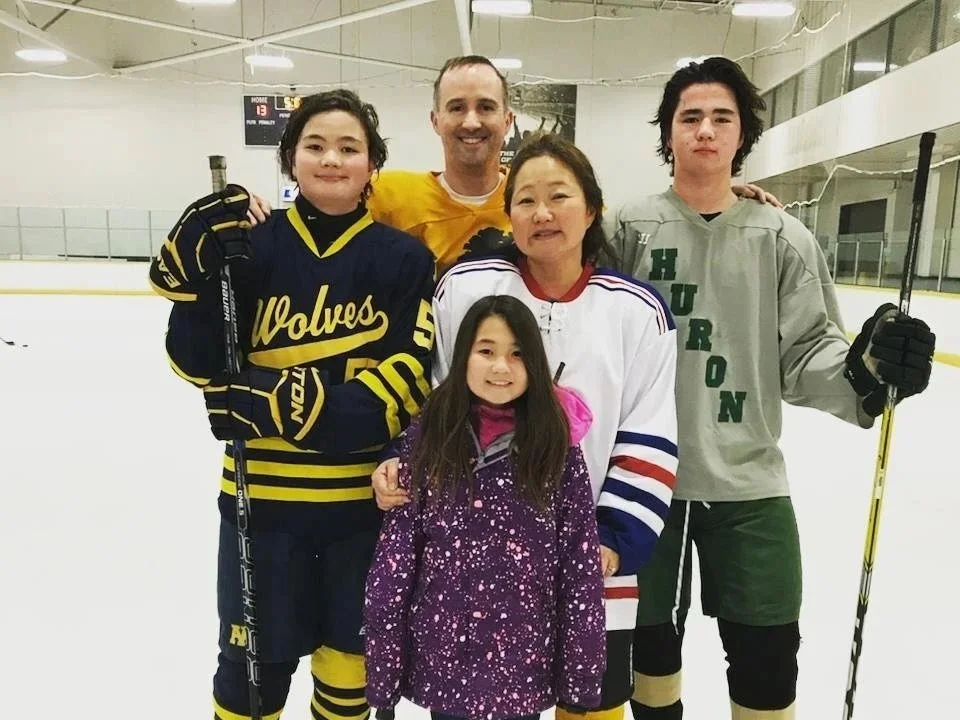 Sandy with her family at the ice rink.