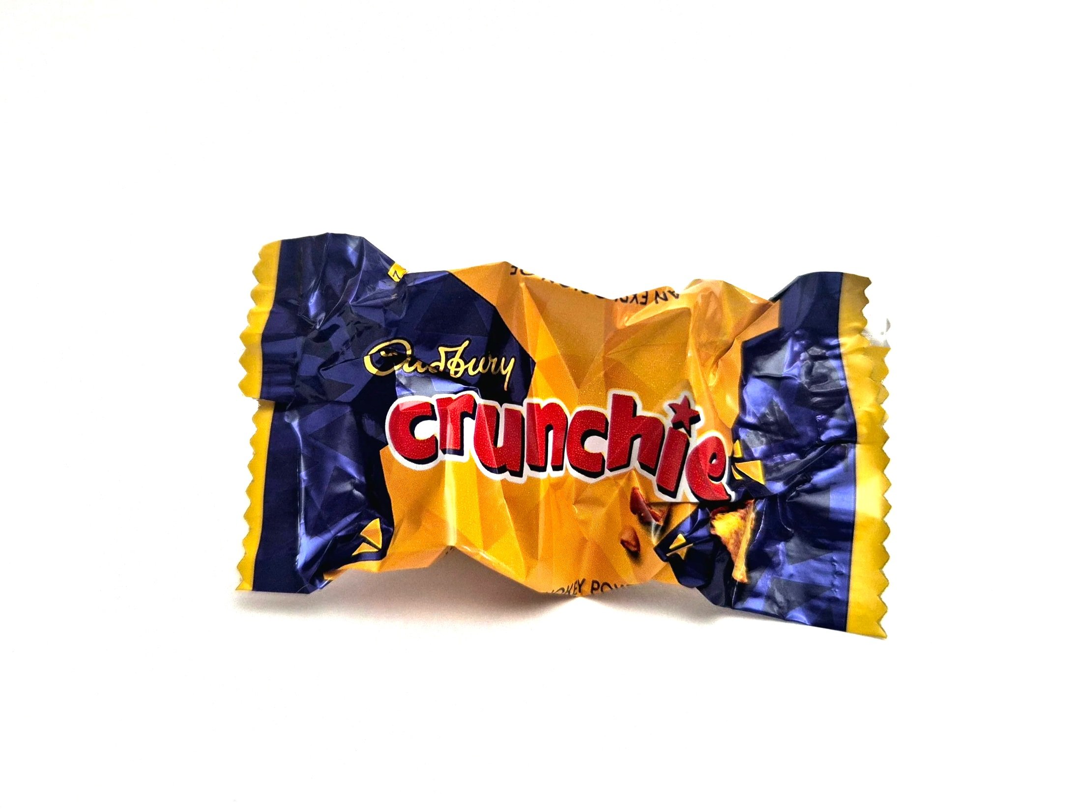 Partially visible packet of Auntie Anne's Pretzel Bites, with blue and yellow packaging, on a white background.