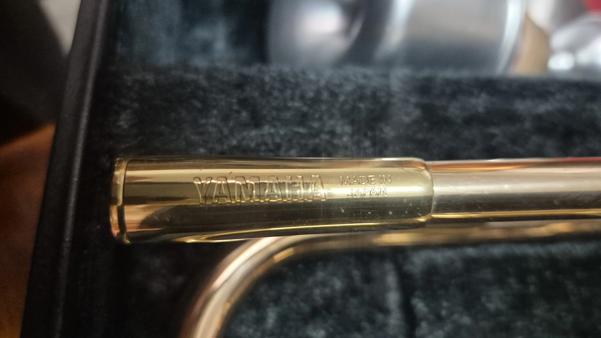 Close-up of a metallic object with engraved text: 'YAMAZAKI MADE IN JAPAN.'