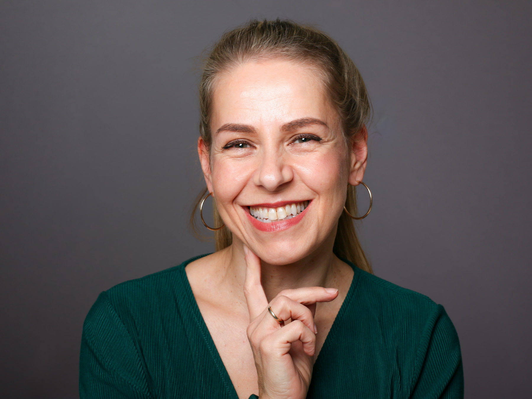 Smiling patient representing cosmetic crowns and natural-looking restorative dental care in Cerritos.
