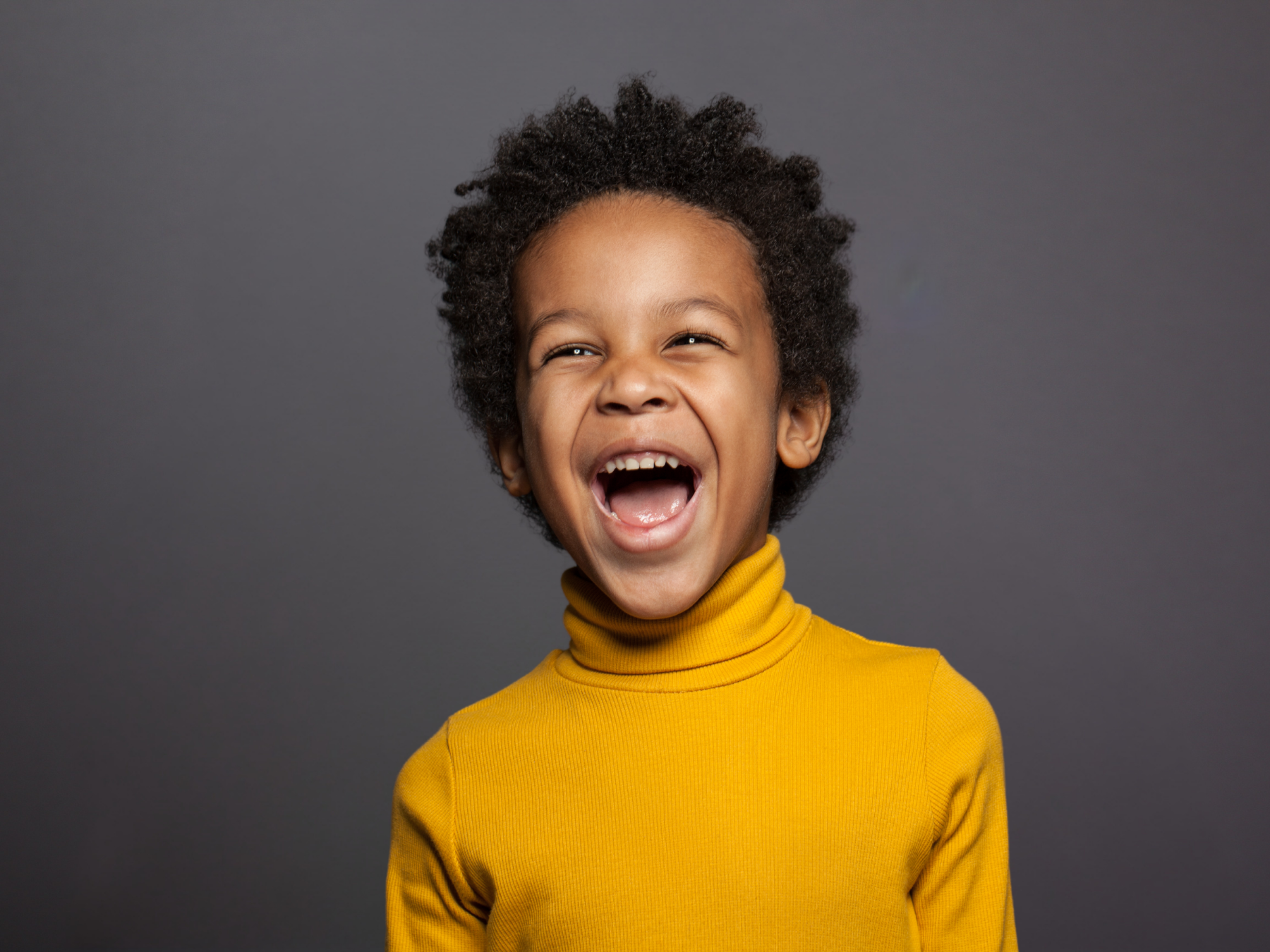 Smiling child representing fluoride treatments that help strengthen enamel and protect healthy smiles at Dental Care of Cerritos.