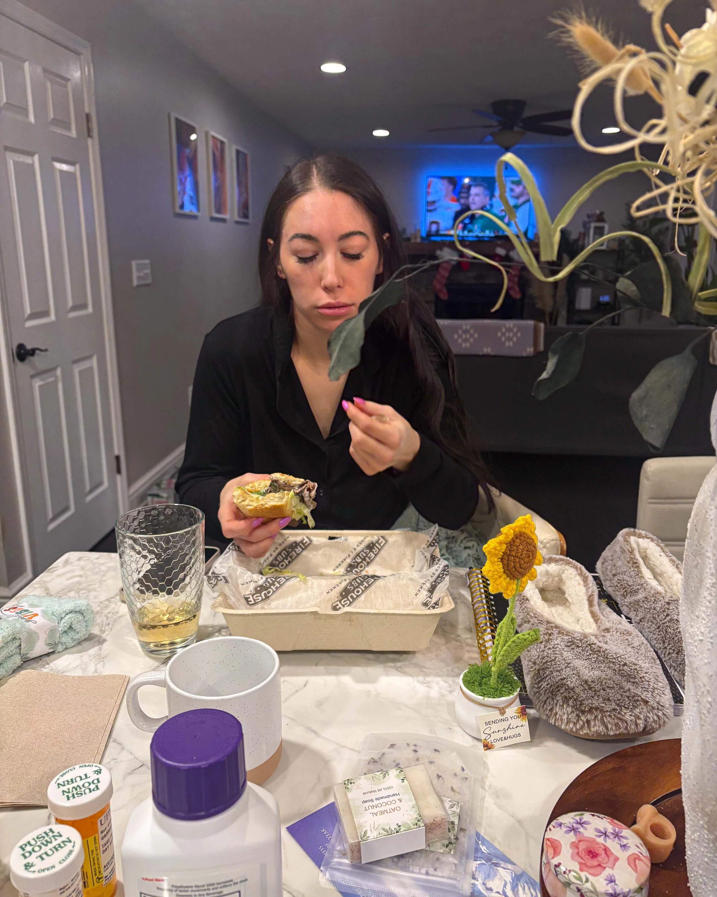 Woman eating a recovery meal while focusing on simple whole foods after endometriosis surgery.