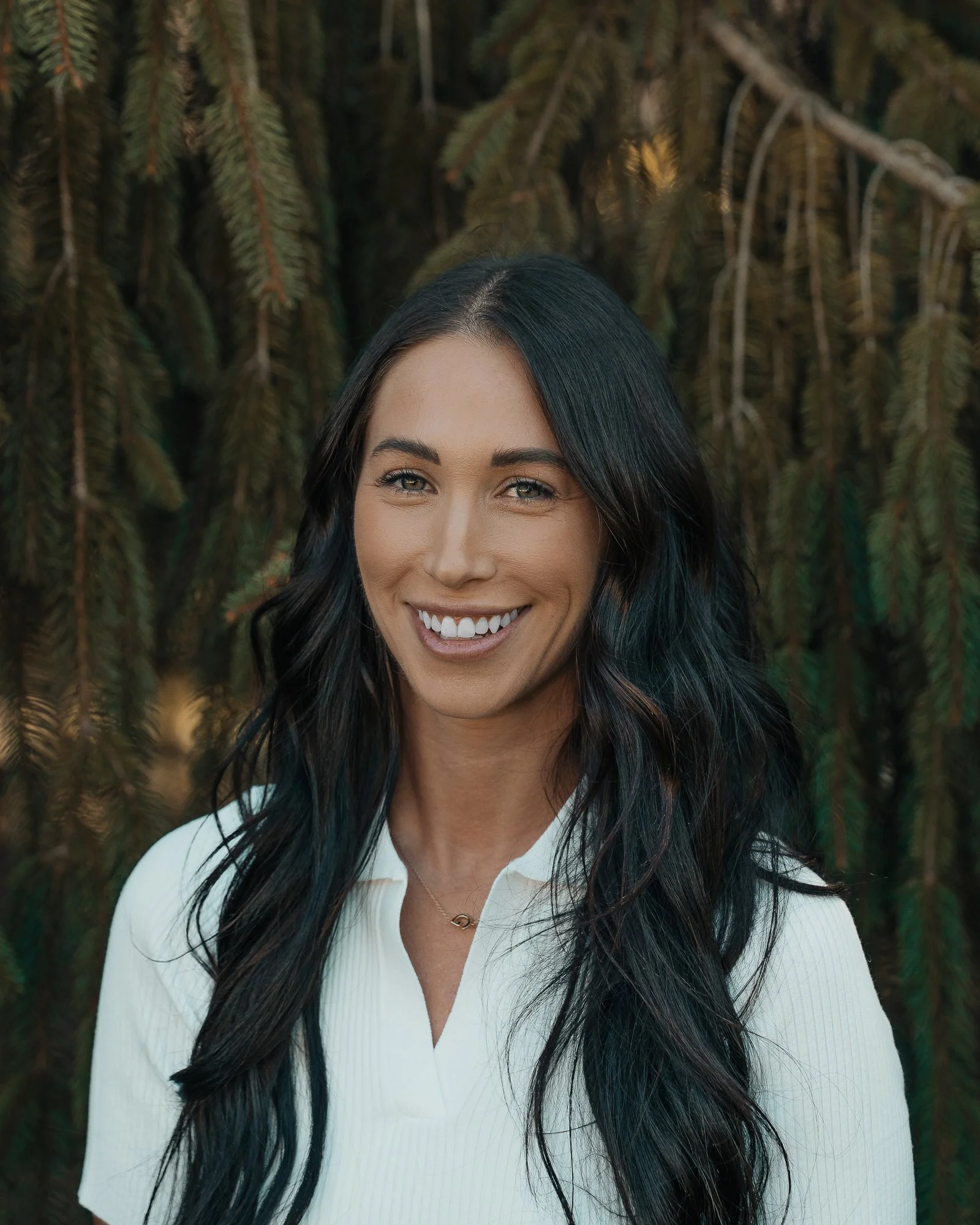 Gabriella Castellani clinical specialist and healthcare professional portrait outdoors in a white blouse