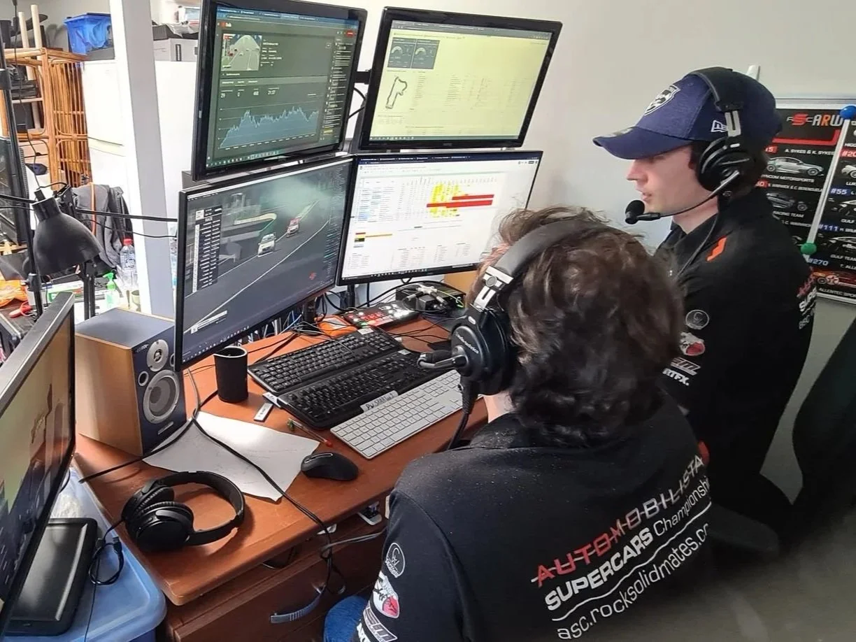 Broadcast technician Alistair Schmidt managing real-time video switching and streaming production for a virtual car race event.