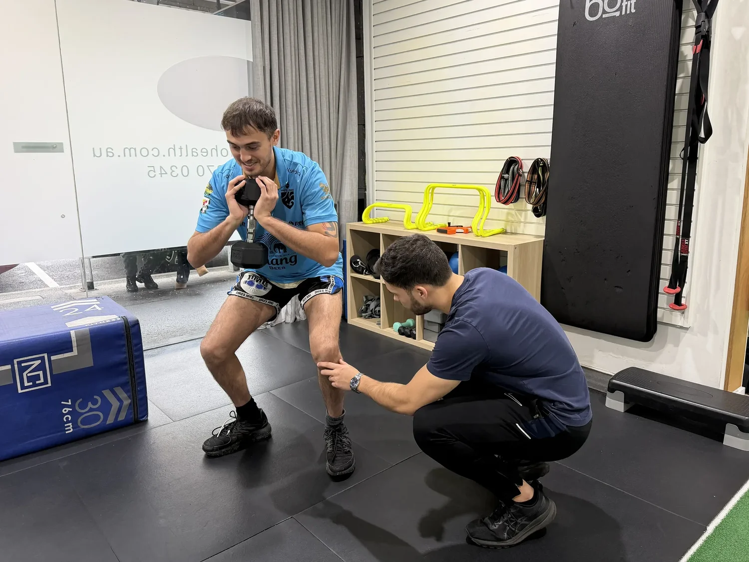 Tom Yeung assessing a combat athlete during an in-clinic session in Moonee Ponds