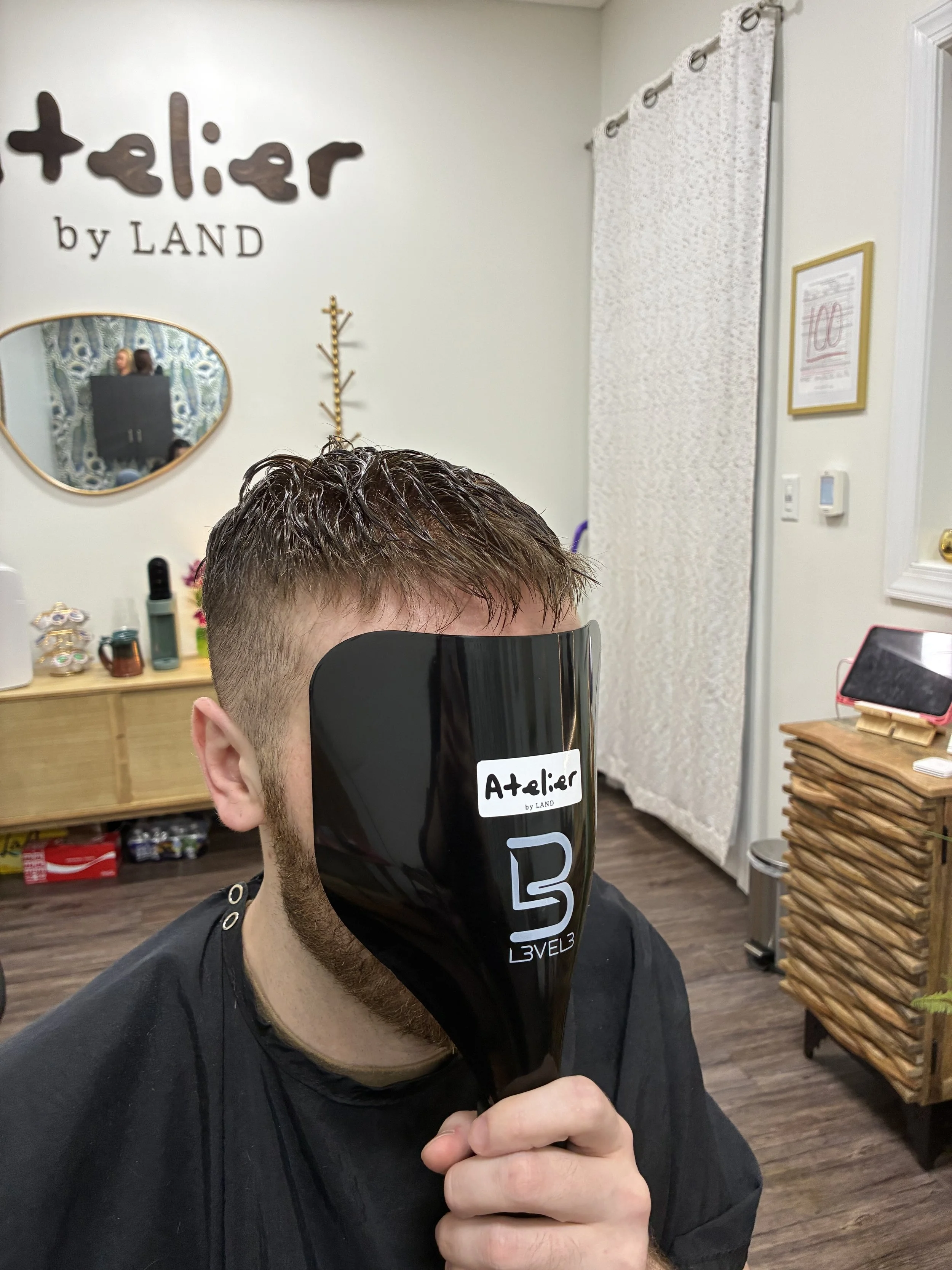 Men's hair system installation at Atelier by Land, a private hair studio in Vestavia Hills, AL. Natural-looking, non-surgical hair replacement for men experiencing thinning or hair loss in the Birmingham, Alabama area.