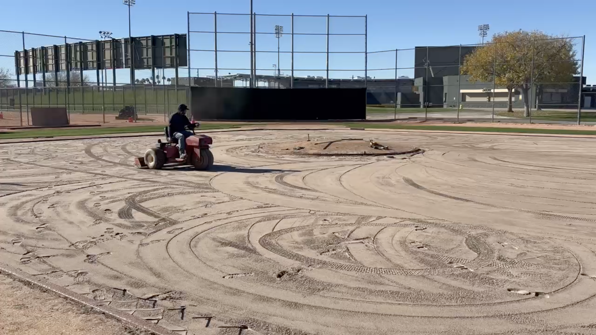 True Hop Field Co, Arizona sports field & court construction, team members working on a baseball field.